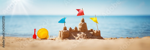 Sandcastle on the sea in summertime Wallpaper Mural