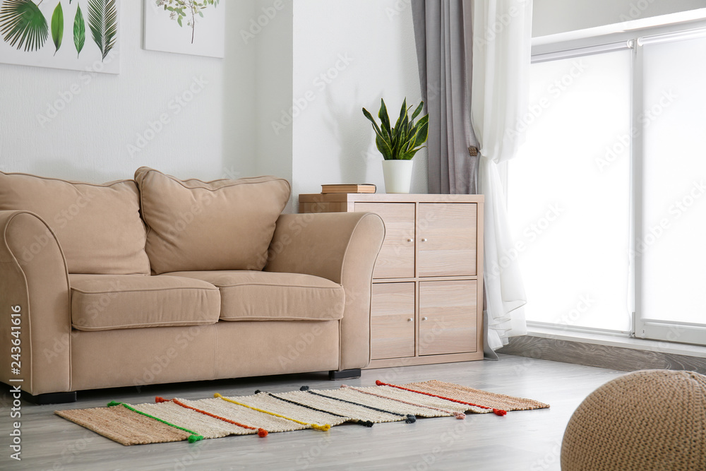 Interior of beautiful room with comfortable sofa