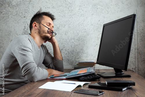 A Man A Man Sleeping At A Table In The Office The Concept Of