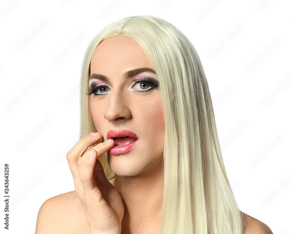 Portrait of young transgender man on white background