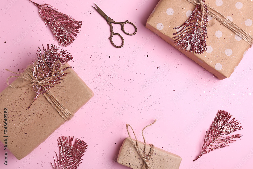 Frame made of gift boxes on color background