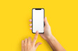 © Prostock-studio - Mockup of female hand holding cell phone with blank screen