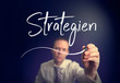 A businessman writing a Strategy 