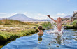 © Westend61 - Chile, Salar del Carmen, two boys bathing in hot spring