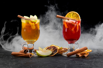 cocktails on a black background with smoke