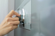 Hand Of Businesswoman Opening Code Lock Of Her Safe
