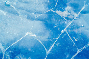 Wall Mural - abstract ice background. blue background with cracks on the ice surface