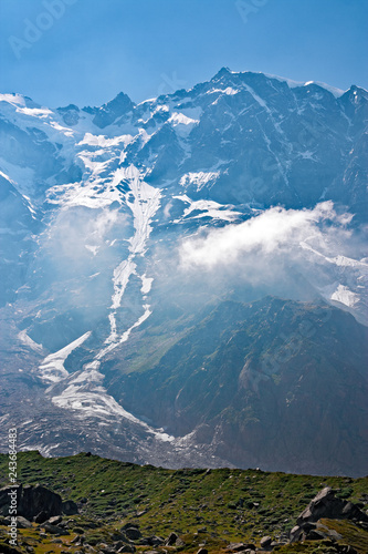 Fotografie, Obraz Panoramic view of the imposing east face of Monte Rosa against the light, above Macugnaga in Piedmont, Italy