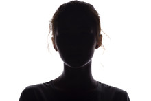 Silhouette Of A Girl Confidently Looking Forward, A Young Woman's Head With A Curl On A White Isolated Background