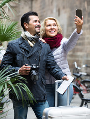 Wall Mural - Elderly tourists taking selfie