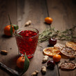 © Max - Pomegranate juice with pomegranates and dried fruits on a wooden table. Country style.