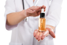 Cropped View Of Female Doctor Holding Bottle Of Cdb Oil And Dropper Isolated On White