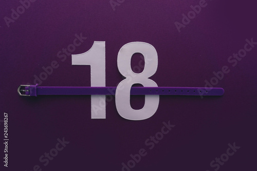 Photographie 18 number eighteen, graphic white digit and creative typography with belt, happy