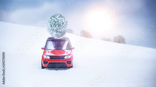 Ein Rotes Auto Fahrt Mit Einem Weihnachtsbaum Auf Dem Dach Durch Eine Winterlandschaft Die Sonne Scheint Lens Flares Buy This Stock Photo And Explore Similar Images At Adobe Stock Adobe Stock