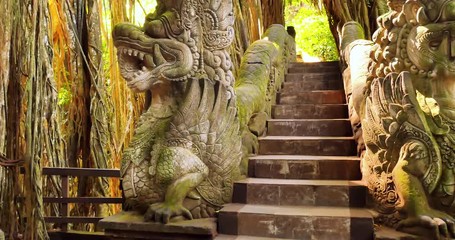 Wall Mural - Old dragon statues decorated with traditional Hindu ornaments temple site inUbud, Bali, Indonesia