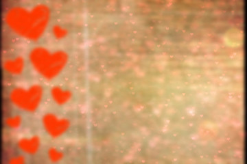 Gray grunge background with painted red hearts on the left. The concept of Valentine`s day. Copy space, space for text.