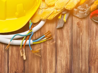 Wall Mural - Yellow hard hat and leather work gloves