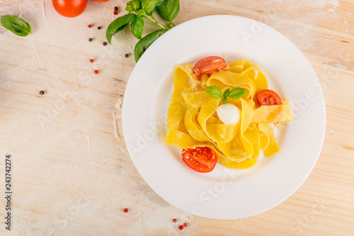 Fotografie, Obraz Yellow italian pasta pappardelle, fettuccine or tagliatelle