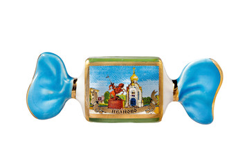 ceramic souvenir toy in the form of candy with color painting on isolated white background reflecting the national Russian culture with the inscription in Russian: The name of the city of Ivanovo