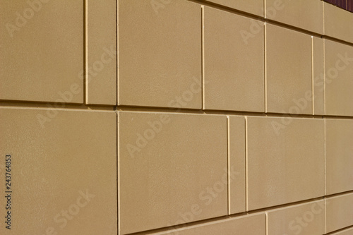 Fotografie, Obraz Modern brown color stone wall background with geometric shape blocks (angle view