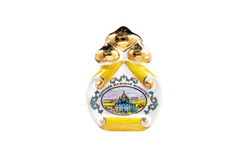 Wall Mural - ceramic souvenir toy in the form of Church with beautiful color painting on isolated white background reflecting the national Russian culture with the inscription in Russian: Zadonsk monastery