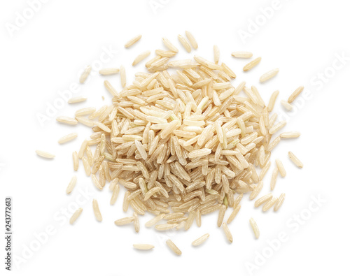 Fotomural Pile of brown rice on white background, top view