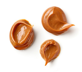 Wall Mural - melted caramel on a white background