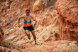 A man Runner of Trail . and athlete's feet wearing sports shoes for trail running in the mountains