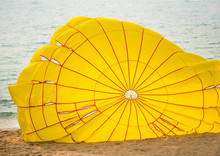 Yellow Parachute  After Landing On The Beach.