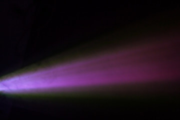 beautiful purple pantone color wide lens projector spotlight . smoke abstract texture black background . screening for multimedia .