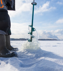 Sticker - Man catches fish on ice in winter