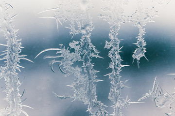 Snow patterns on glass as an abstract background