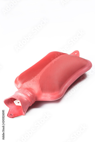 Fotografia rubber hot water bottle isolated on white background with copy space for your te