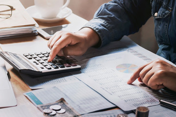 Fototapete - businessman using calculator for calculate budget. concept finance