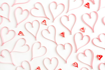 Valentines Day background with paper heart symbols on white. Flat lay, top view love concept.