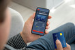 © DenPhoto - male hands holding phone app online shopping and credit card