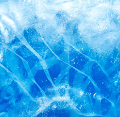 Wall Mural - abstract ice background. blue background with cracks on the ice surface