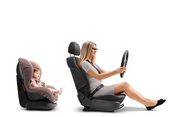 Wall Mural - Young woman sitting in car seat and holing steering wheel