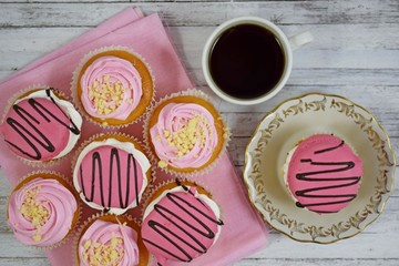 Wall Mural - Delicious cakes on wooden background.Sweet dessert for coffee.