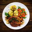 Grilled steak with potatoes and vegetable salad