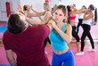 © JackF - Sporty female with trainer are doing self-defence moves in gym