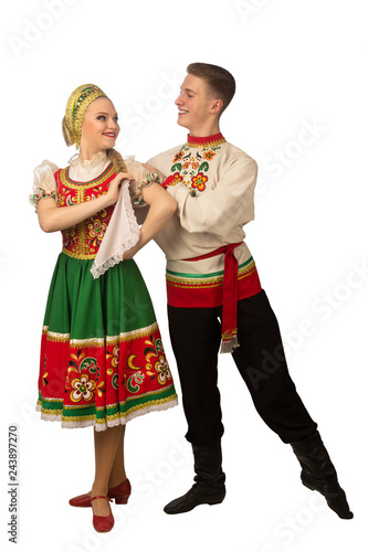Fotografie, Obraz Beautiful caucasian cuple dancing in Russian folk costumes isolated on white