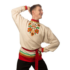 Wall Mural - Attractive russian guy dancing in folk costume isolated on white