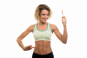 Portrait of beautiful young fit girl showing diabetes shot