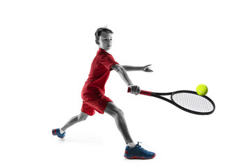 Wall Mural - Young teen boy tennis player in motion or movement isolated on white studio background. The sport, exercise, training concept