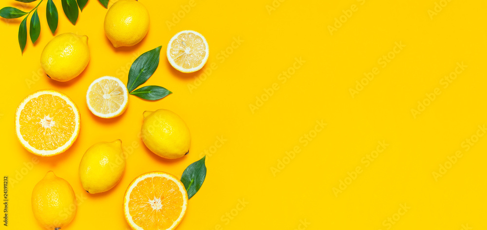 Ripe juicy lemons, orange and green leaves on bright yellow background. Lemon fruit, citrus minimal concept, vitamin C. Creative summer minimalistic background. Flat lay, top view, copy space. - obrazy, fototapety, plakaty 