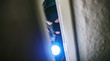 © AA+W - burglar with torch opens door of appartment