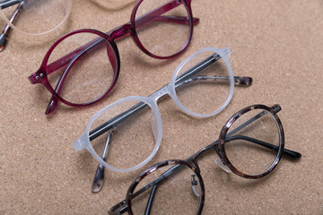 Sticker - Different eyeglass frames on cork board