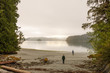 © ML Harris - Two men walking on a wilderness beach in the Broken Group Islands, Barkley Sound, Pacific Rim National Park, B.C., Canada. Hiking exploration adventure travel.