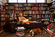© ML Harris - Woman with dog sitting on sofa at home